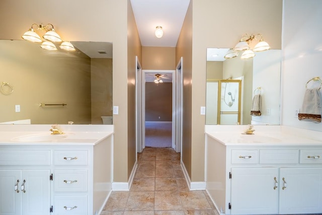 401 Dunleith Blvd, Dothan, AL 36303 - bathroom with two vanities, tile patterned flooring, baseboards, and a shower stall
