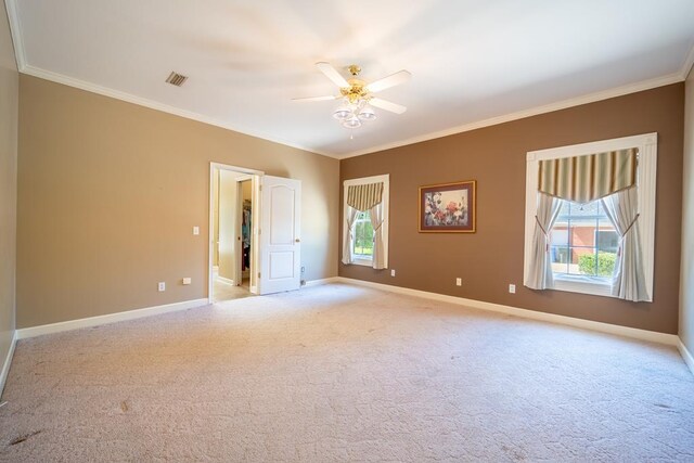 401 Dunleith Blvd, Dothan, AL 36303 - spare room with crown molding, healthy amount of natural light, a ceiling fan, and light colored carpet