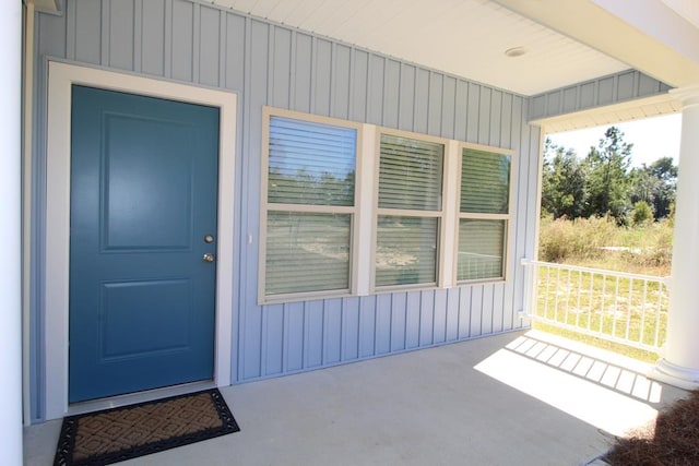 property entrance featuring covered porch