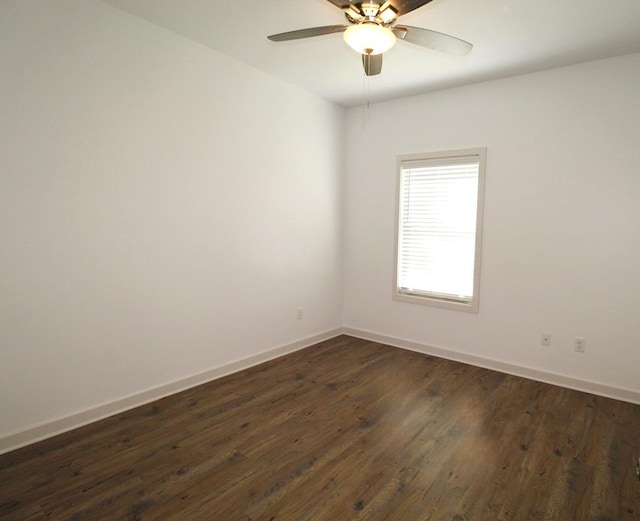 unfurnished room featuring ceiling fan and dark hardwood / wood-style flooring