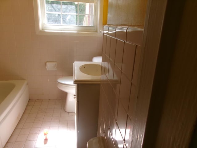 934 Sunset Blvd, Elba, AL 36323 - full bathroom featuring tile walls, a tub, vanity, and tile patterned flooring