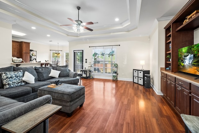115 Brittany Dr, Dothan, AL 36301 - living room featuring a tray ceiling, a ceiling fan, ornamental molding, dark wood-type flooring, and recessed lighting