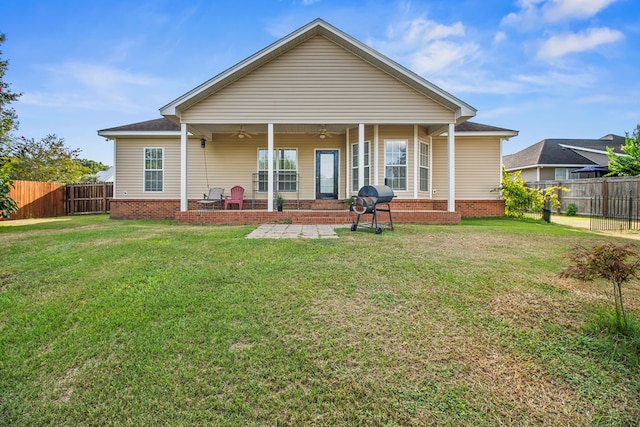 115 Brittany Dr, Dothan, AL 36301 - back of house with a ceiling fan, a fenced backyard, and brick siding