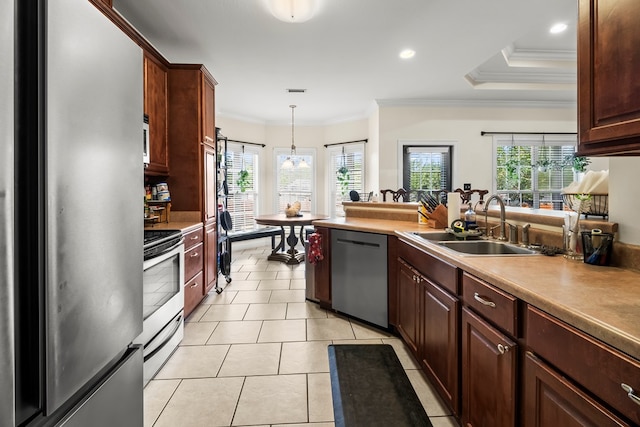 115 Brittany Dr, Dothan, AL 36301 - kitchen with appliances with stainless steel finishes, pendant lighting, ornamental molding, light tile patterned floors, and light countertops