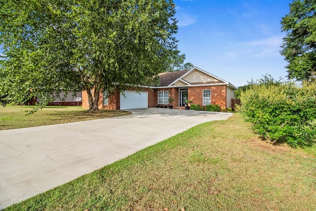 115 Brittany Dr, Dothan, AL 36301 - view of front of property with a garage, concrete driveway, brick siding, and a front lawn