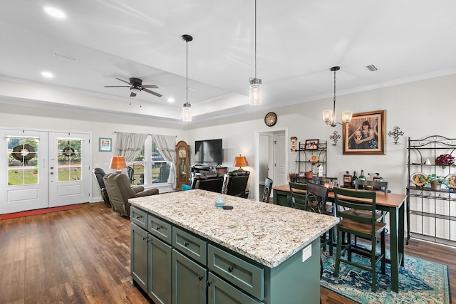 1908 Baxter Rd, Ashford, AL 36312 - kitchen with green cabinetry, ornamental molding, dark wood-style floors, a ceiling fan, and open floor plan