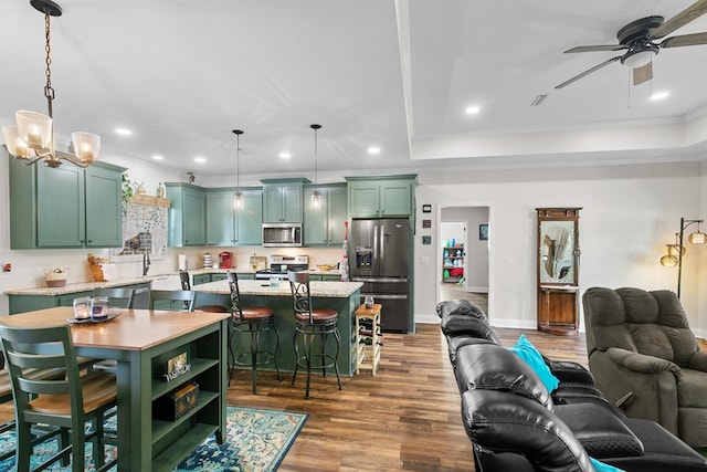 1908 Baxter Rd, Ashford, AL 36312 - living room with ceiling fan, recessed lighting, dark wood finished floors, crown molding, and a chandelier