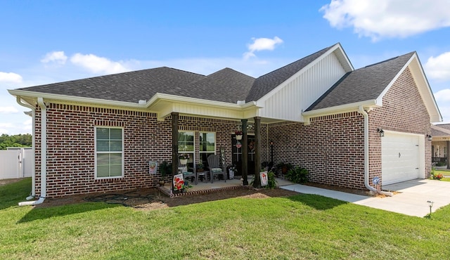 1908 Baxter Rd, Ashford, AL 36312 - back of house with brick siding, a garage, a shingled roof, a yard, and driveway