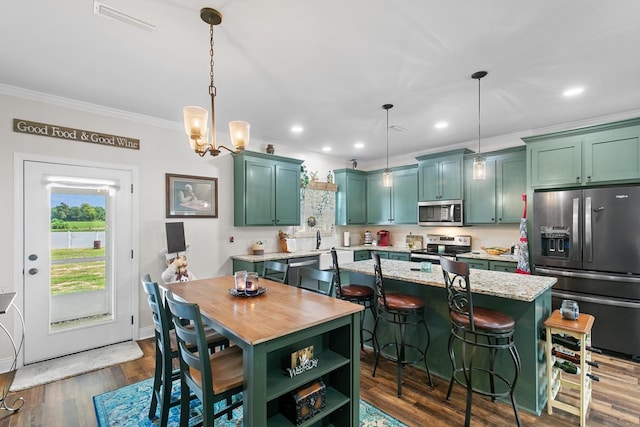 1908 Baxter Rd, Ashford, AL 36312 - dining space featuring ornamental molding, recessed lighting, dark wood finished floors, and a chandelier
