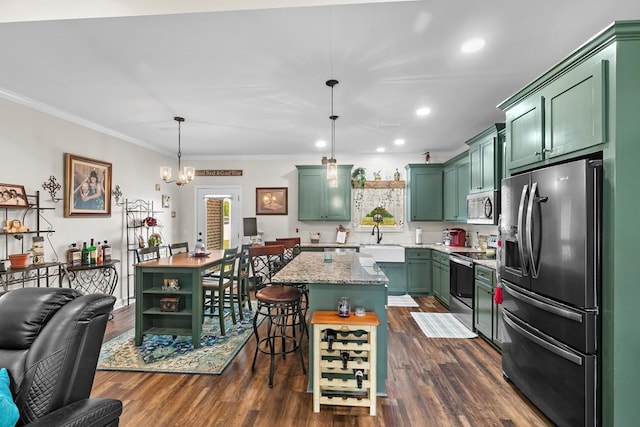 1908 Baxter Rd, Ashford, AL 36312 - kitchen featuring appliances with stainless steel finishes, green cabinets, a kitchen island, crown molding, and dark wood-style flooring