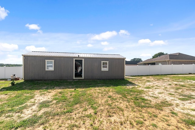 1908 Baxter Rd, Ashford, AL 36312 - back of property with a fenced backyard and a metal roof