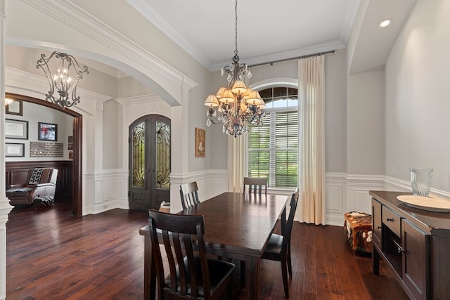 dining space with dark wood-style floors, french doors, arched walkways, wainscoting, and a chandelier