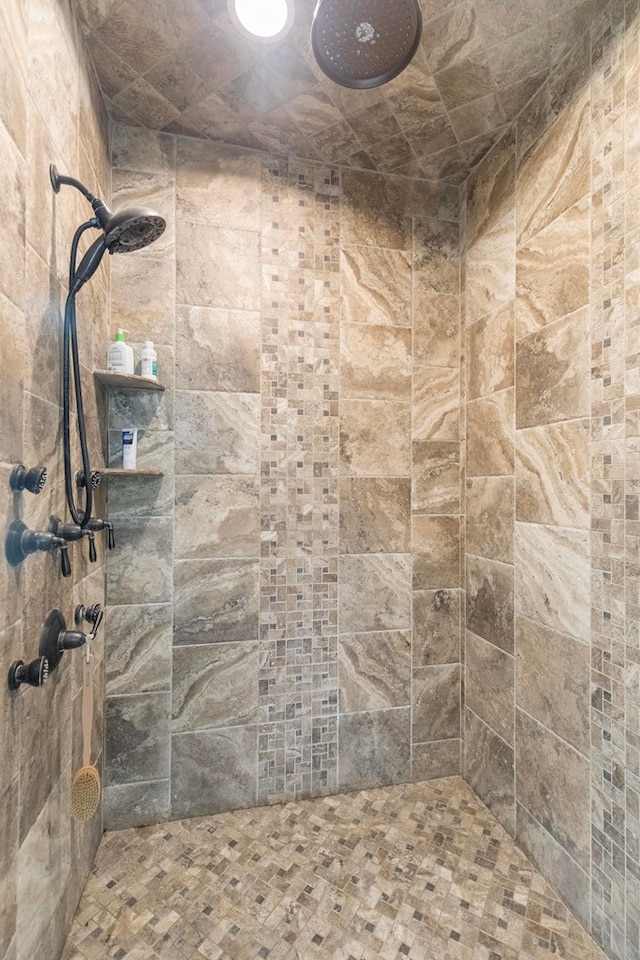 full bath featuring a tile shower