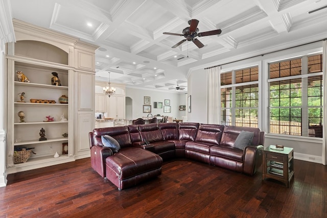 living room with dark wood finished floors, beamed ceiling, ceiling fan with notable chandelier, and coffered ceiling