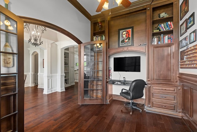 office featuring built in features, dark wood finished floors, arched walkways, ceiling fan, and crown molding