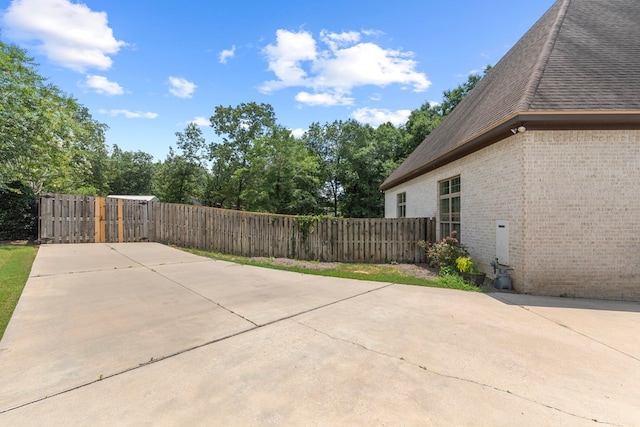 view of patio featuring fence