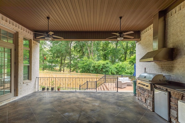 view of patio / terrace featuring an outdoor kitchen, a grill, ceiling fan, and fence