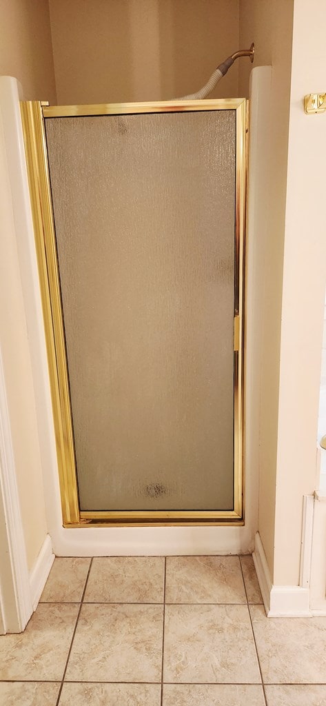 301 Roslyn Glen Way, Dothan, AL 36305 - bathroom featuring a stall shower and tile patterned floors