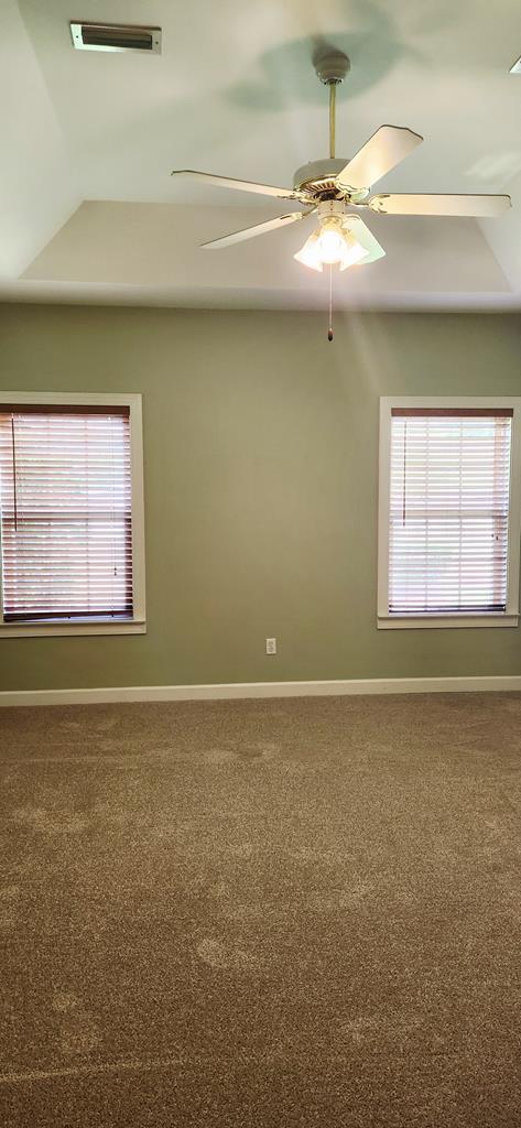 301 Roslyn Glen Way, Dothan, AL 36305 - carpeted empty room featuring a ceiling fan and a tray ceiling