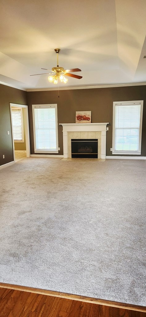 301 Roslyn Glen Way, Dothan, AL 36305 - unfurnished living room featuring a fireplace, a ceiling fan, and carpet