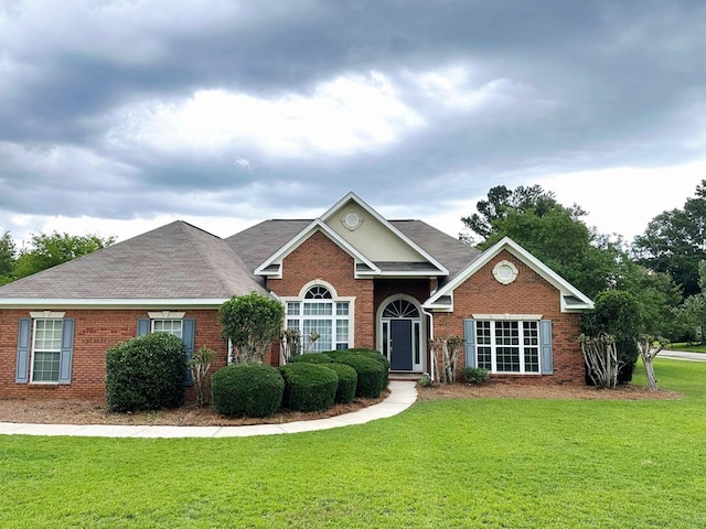 301 Roslyn Glen Way, Dothan, AL 36305 - view of front facade with brick siding, a front lawn, and a shingled roof