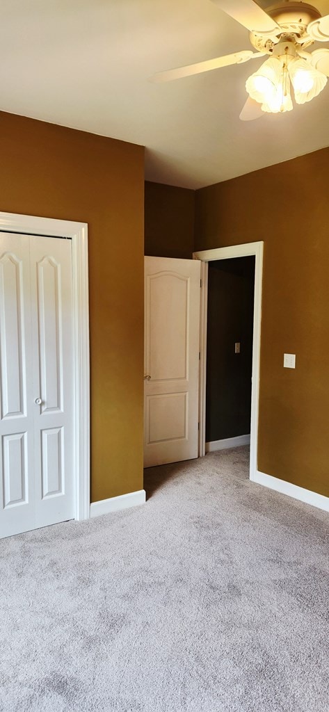 301 Roslyn Glen Way, Dothan, AL 36305 - unfurnished bedroom featuring light carpet, a closet, and ceiling fan