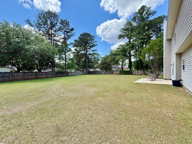 view of yard with a fenced backyard and a patio area