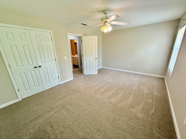unfurnished bedroom with visible vents, baseboards, and carpet floors