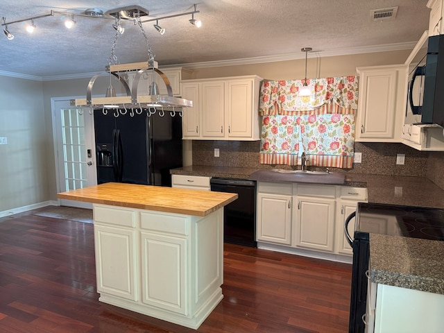 26 Goff St, Daleville, AL 36322 - kitchen with black appliances, butcher block countertops, white cabinetry, a textured ceiling, and dark wood-style floors