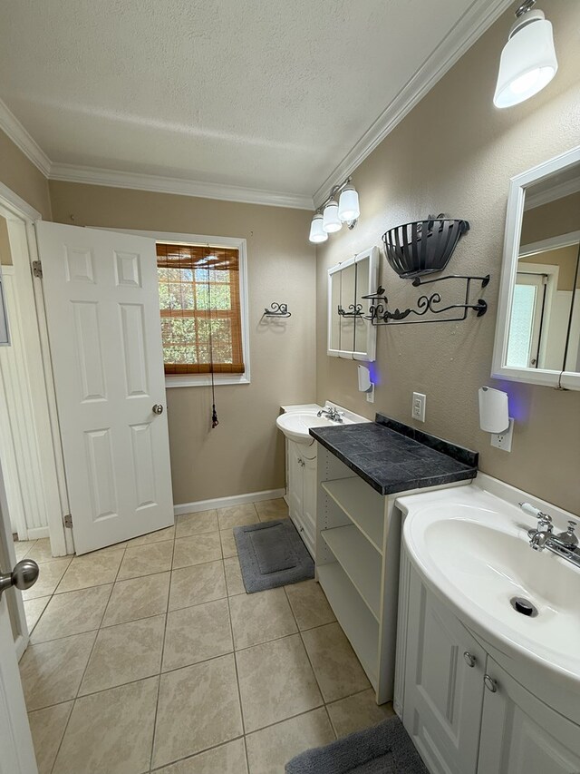 26 Goff St, Daleville, AL 36322 - full bathroom with crown molding, a textured ceiling, two vanities, and tile patterned flooring