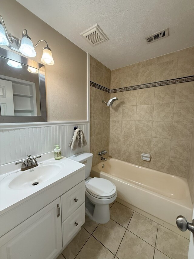 26 Goff St, Daleville, AL 36322 - bathroom featuring vanity, tile patterned floors, bathtub / shower combination, a wainscoted wall, and a textured ceiling