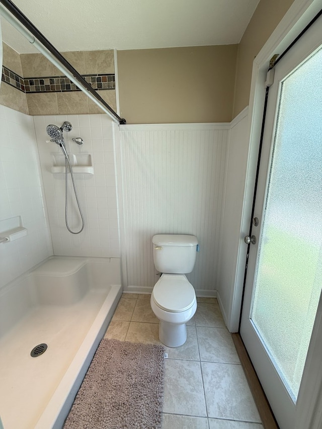 26 Goff St, Daleville, AL 36322 - bathroom with a stall shower, wainscoting, and tile patterned flooring