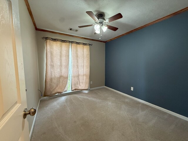 26 Goff St, Daleville, AL 36322 - spare room with crown molding, carpet, ceiling fan, and a textured ceiling
