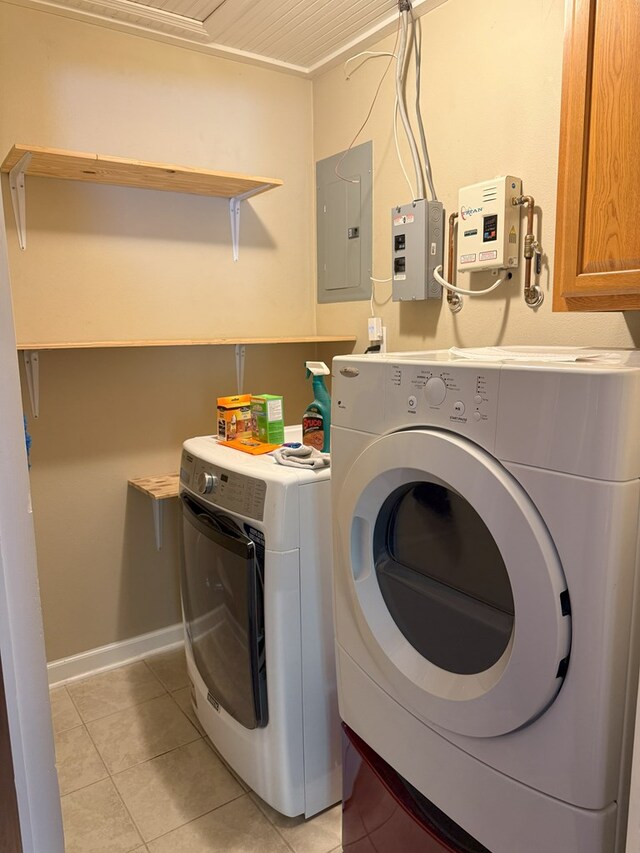 26 Goff St, Daleville, AL 36322 - washroom with electric panel, cabinet space, washer and dryer, and light tile patterned floors