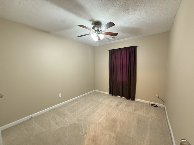 26 Goff St, Daleville, AL 36322 - unfurnished room featuring a ceiling fan, light colored carpet, and a textured ceiling