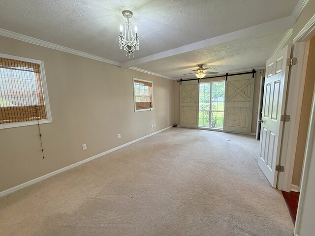 26 Goff St, Daleville, AL 36322 - unfurnished room featuring a barn door, a textured ceiling, light colored carpet, ornamental molding, and a chandelier