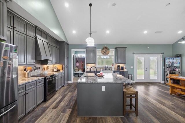 333 County Road 271, Clopton, AL 36317 - kitchen with gray cabinetry, wall chimney exhaust hood, stainless steel appliances, dark hardwood / wood-style flooring, and decorative light fixtures
