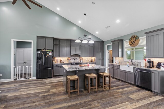 333 County Road 271, Clopton, AL 36317 - kitchen featuring fridge with ice dispenser, a center island, dark hardwood / wood-style flooring, high vaulted ceiling, and stainless steel dishwasher