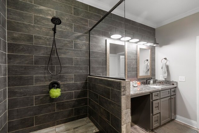 333 County Road 271, Clopton, AL 36317 - bathroom with tiled shower, hardwood / wood-style floors, vanity, and ornamental molding