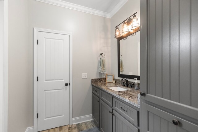 333 County Road 271, Clopton, AL 36317 - bathroom with hardwood / wood-style flooring, vanity, and crown molding