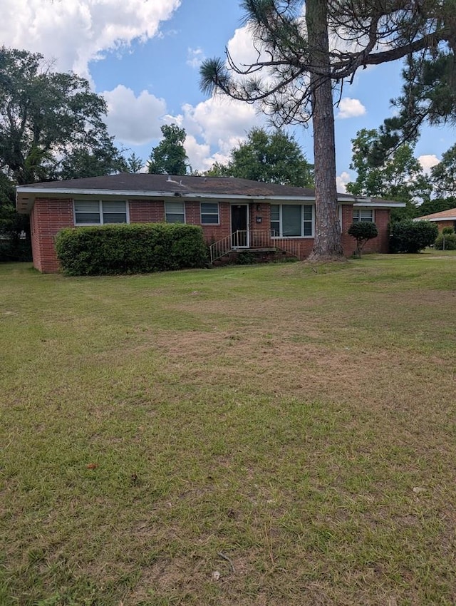 2004 Brackin Dr, Dothan, AL 36301 - ranch-style home featuring a front lawn and brick siding