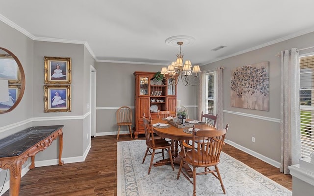 dining area featuring an inviting chandelier, dark wood-type flooring, and crown molding