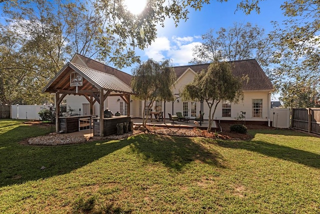 view of yard featuring a gazebo, a hot tub, and a patio area