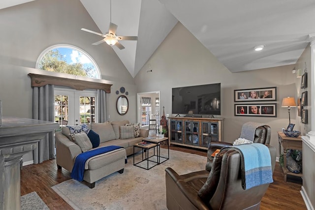 living room with french doors, hardwood / wood-style flooring, high vaulted ceiling, and ceiling fan