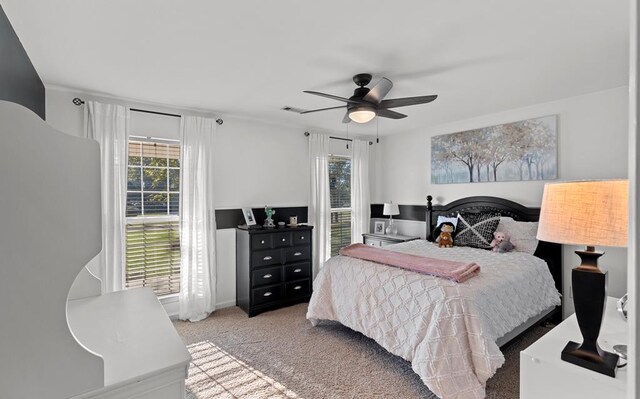 carpeted bedroom featuring ceiling fan