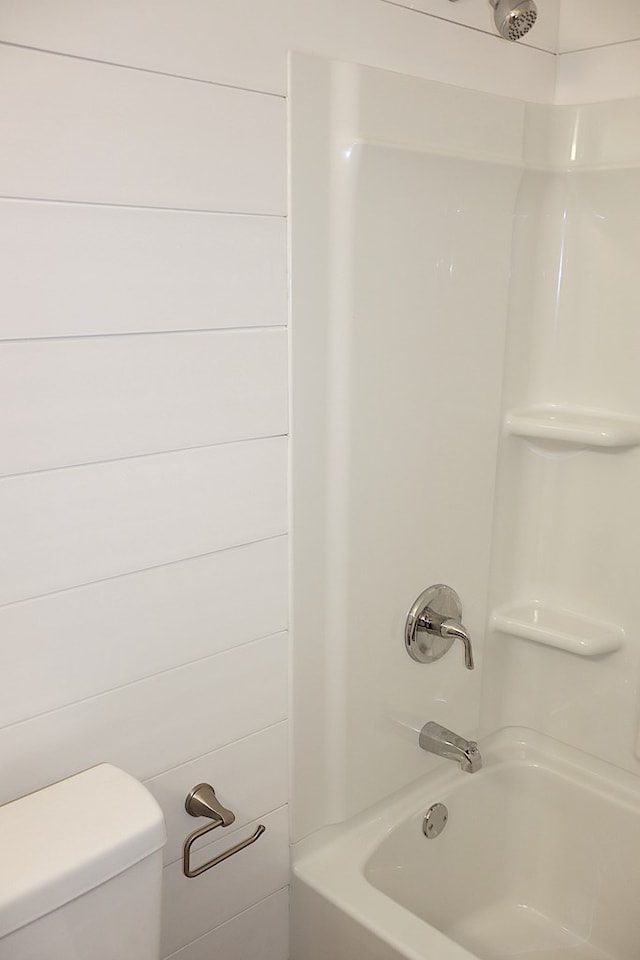 bathroom with toilet and shower / tub combination