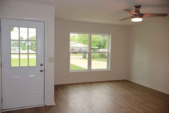 entryway with wood finished floors, baseboards, and ceiling fan