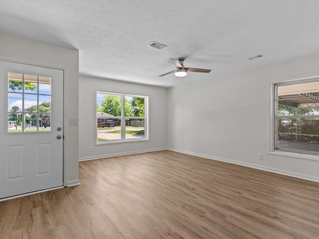 302 Robin Ln, Enterprise, AL 36330 - unfurnished room featuring light wood-style floors, ceiling fan, and baseboards