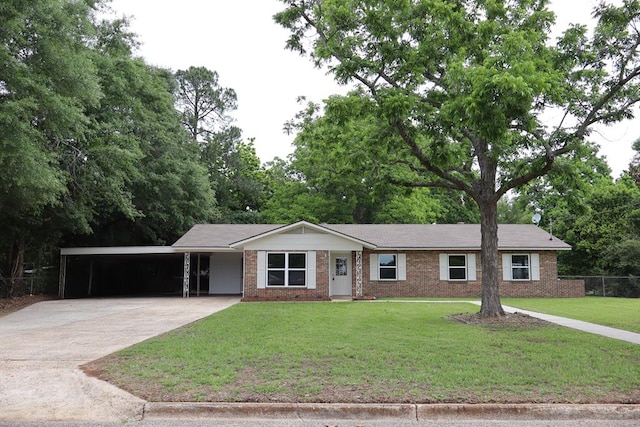 single story home featuring concrete driveway, an attached carport, and brick siding