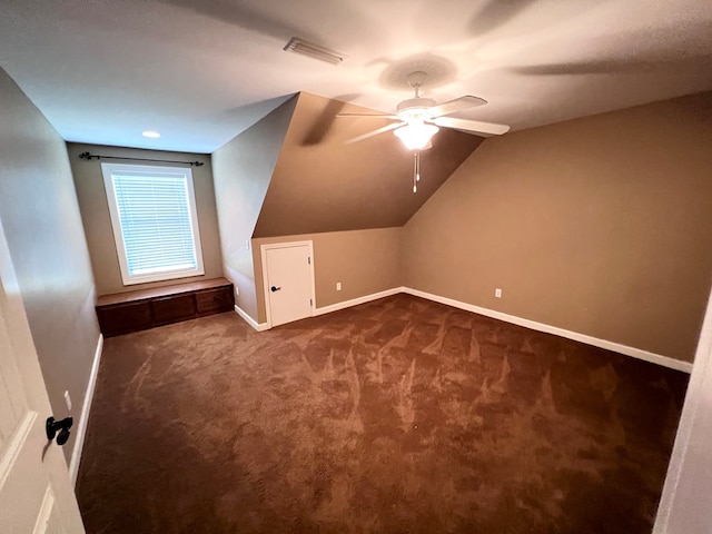 bonus room featuring dark colored carpet, ceiling fan, and lofted ceiling